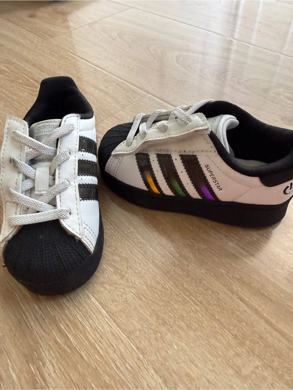 adidas Kids Superstar Sneakers in White, Black and Rainbow Lights